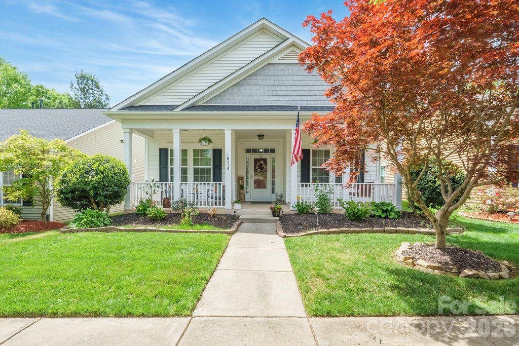 16515 Amberside Road East Cornelius, NC 28031 - Photo 2 of 35 front view of a house with a yard