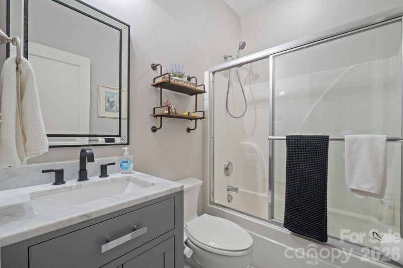 16515 Amberside Road East Cornelius, NC 28031 - Photo 29 of 35 a bathroom with a sink a toilet and shower