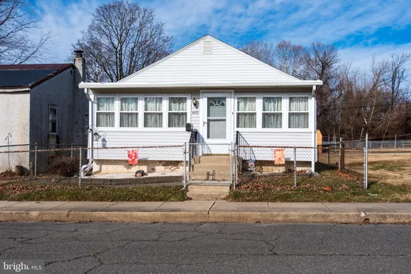 a front view of a house with street