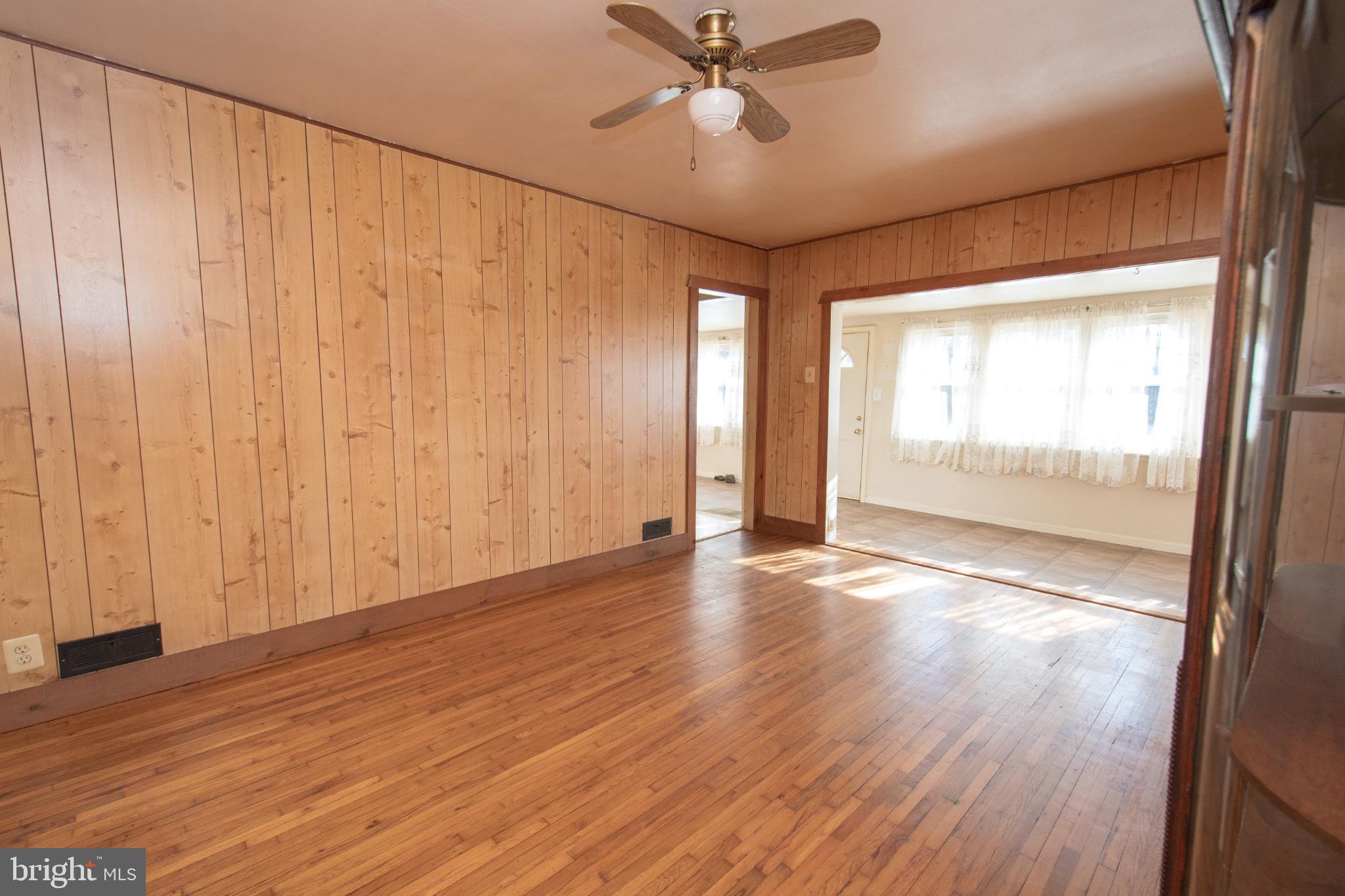 4022 West 7th Street Trainer, PA 19061 - Photo 14 of 49 a view of an empty room with wooden floor and a window
