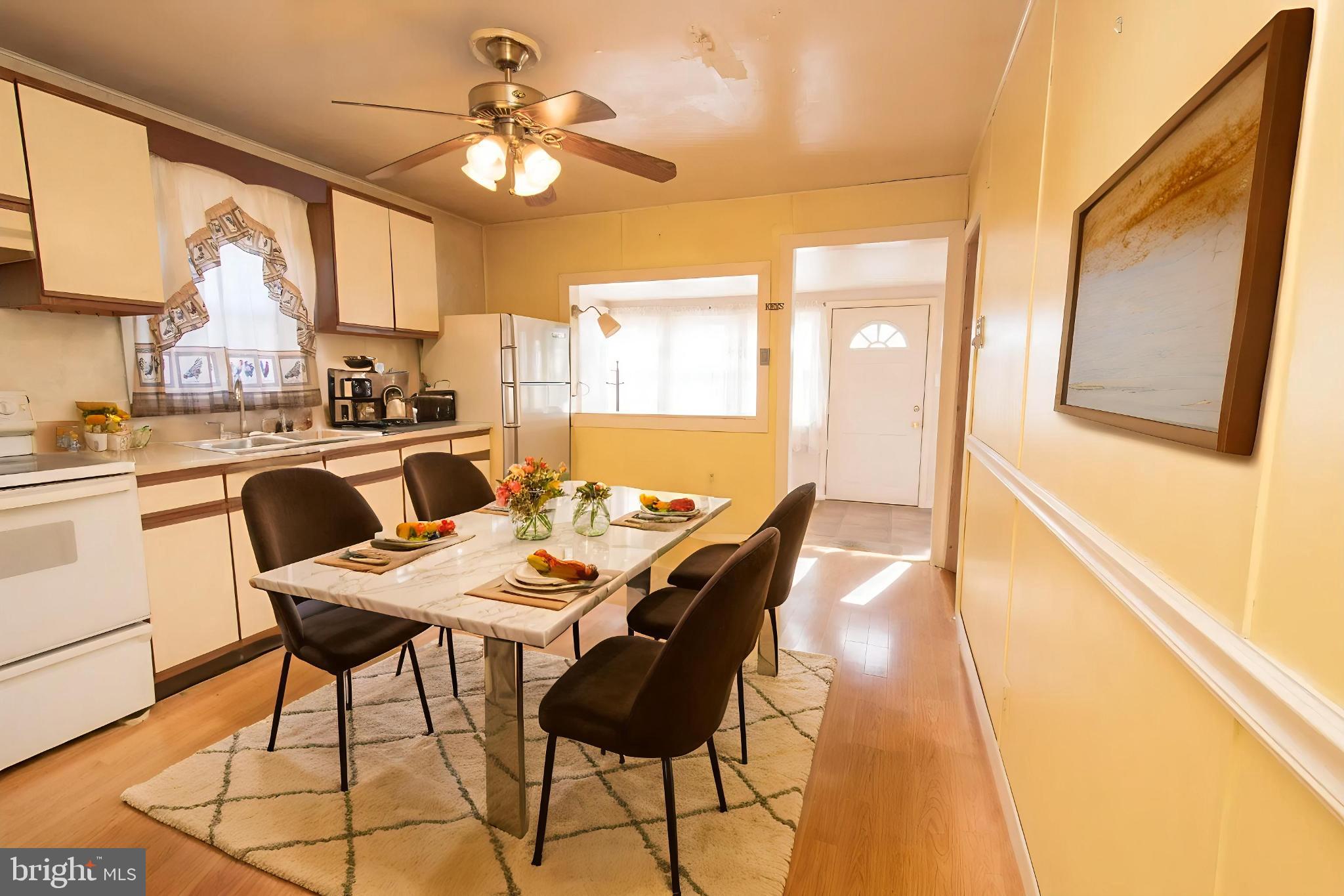 4022 West 7th Street Trainer, PA 19061 - Photo 16 of 49 a view of a dining room with furniture and a chandelier