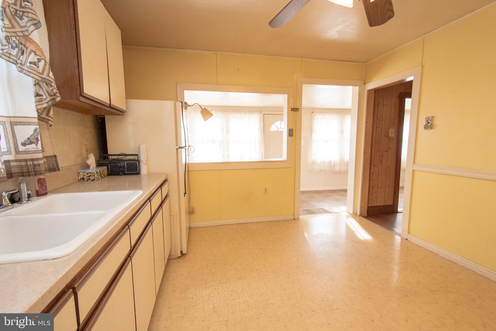 4022 West 7th Street Trainer, PA 19061 - Photo 18 of 49 a view of a kitchen with a sink and a refrigerator