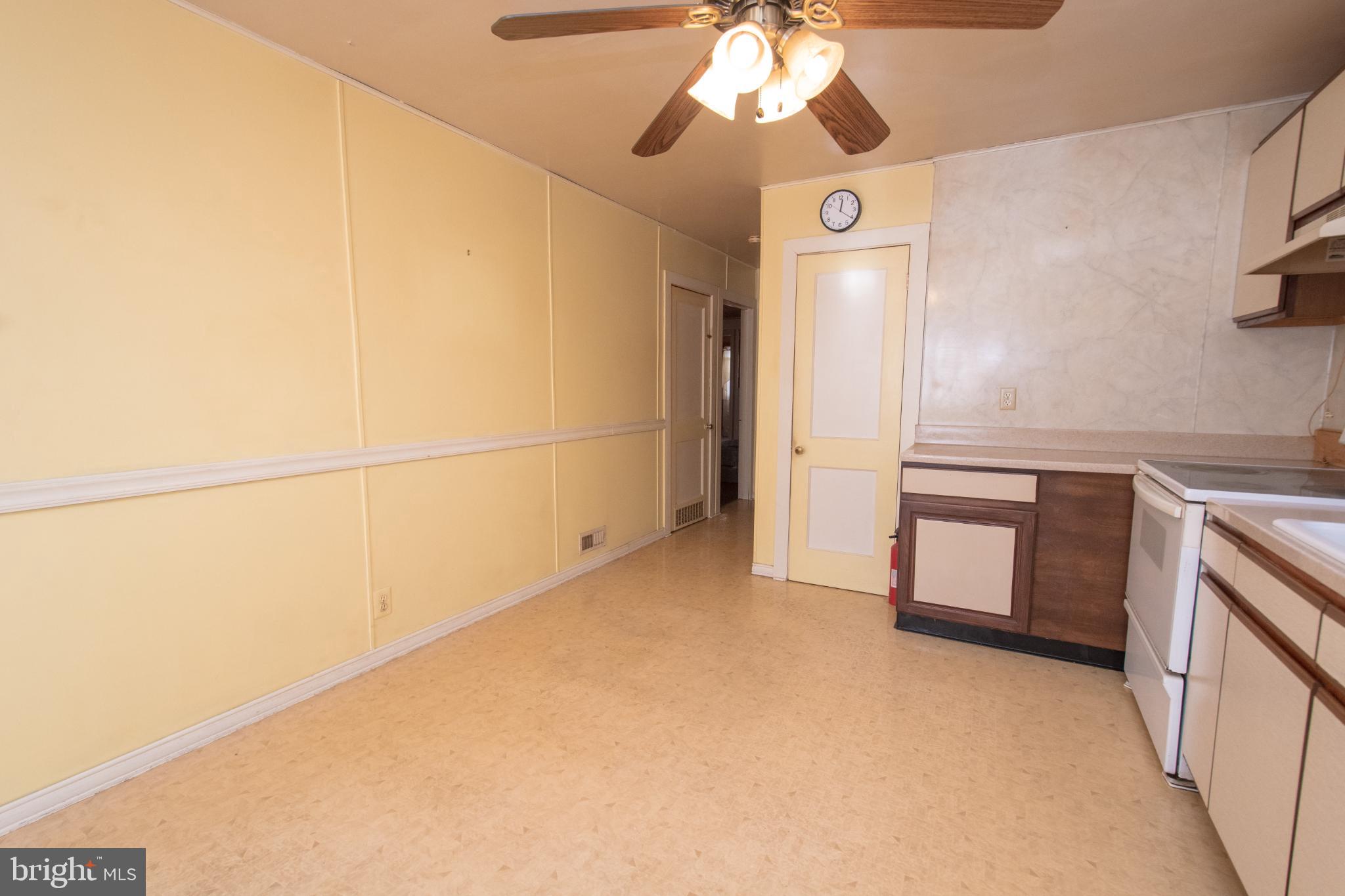4022 West 7th Street Trainer, PA 19061 - Photo 19 of 49 a view of a kitchen with a sink and a refrigerator