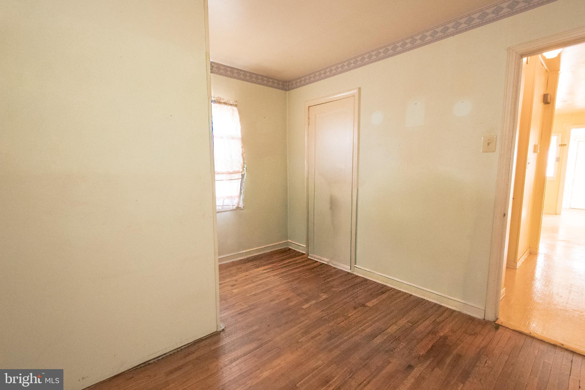 4022 West 7th Street Trainer, PA 19061 - Photo 20 of 49 an empty room with wooden floor and windows