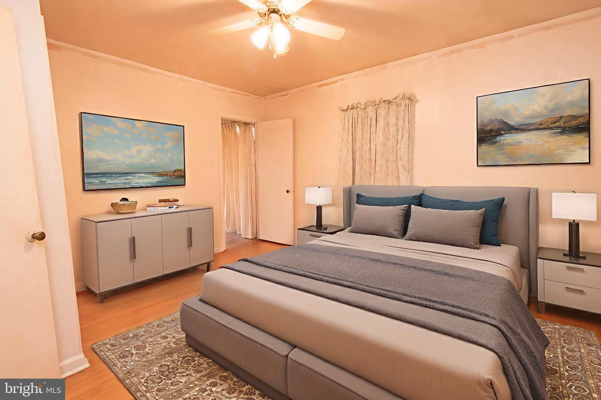 4022 West 7th Street Trainer, PA 19061 - Photo 26 of 49 a spacious bedroom with a bed and a flat screen tv