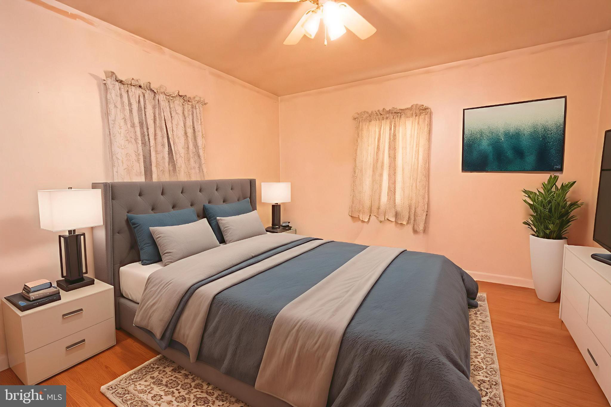 4022 West 7th Street Trainer, PA 19061 - Photo 28 of 49 a bedroom with a bed and a flat screen tv