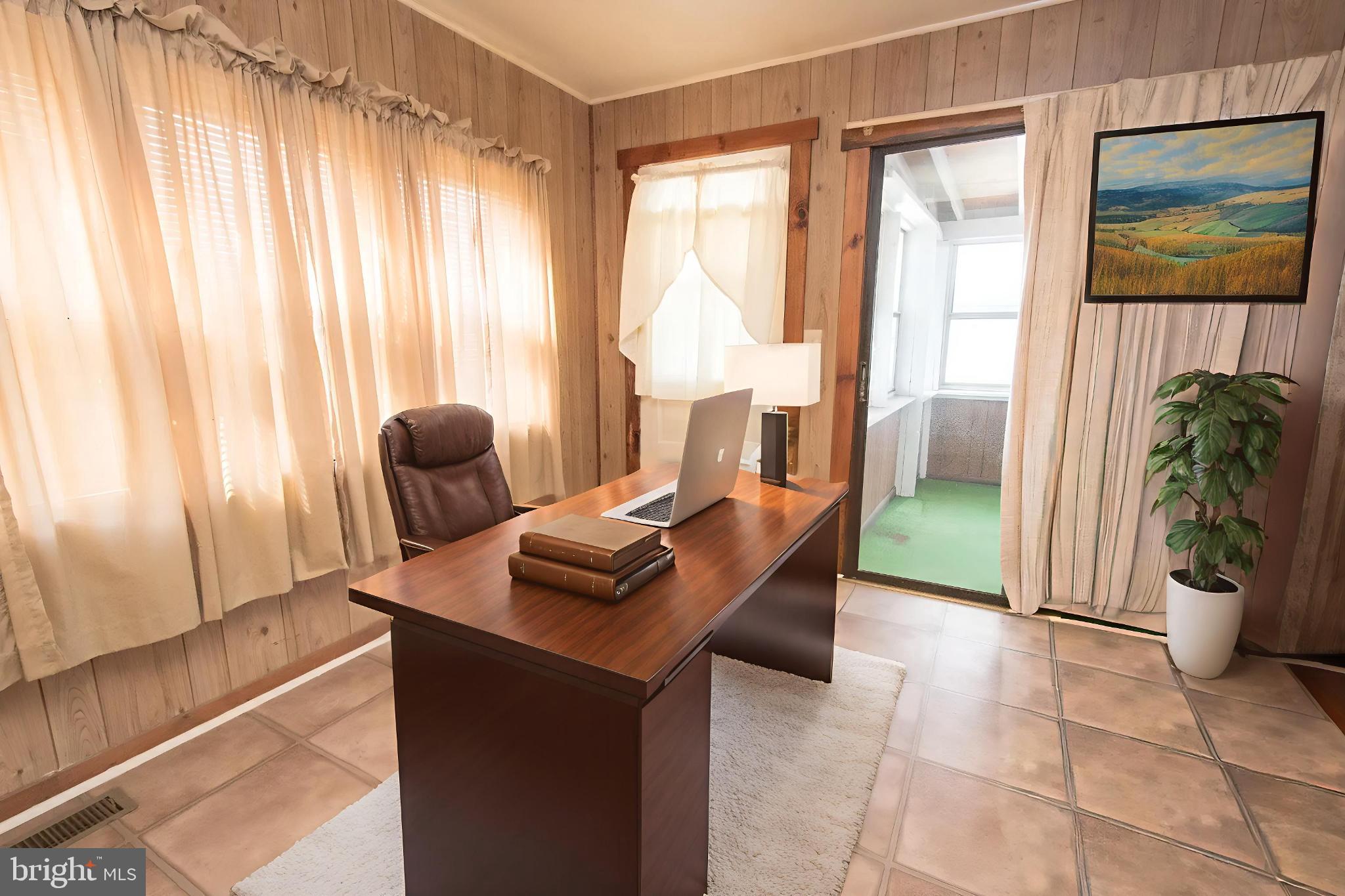4022 West 7th Street Trainer, PA 19061 - Photo 31 of 49 a living room with furniture and a floor to ceiling window