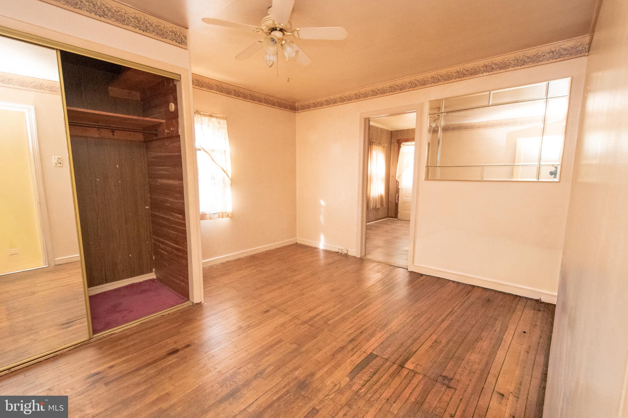 4022 West 7th Street Trainer, PA 19061 - Photo 35 of 49 a view of empty room with wooden floor and fan