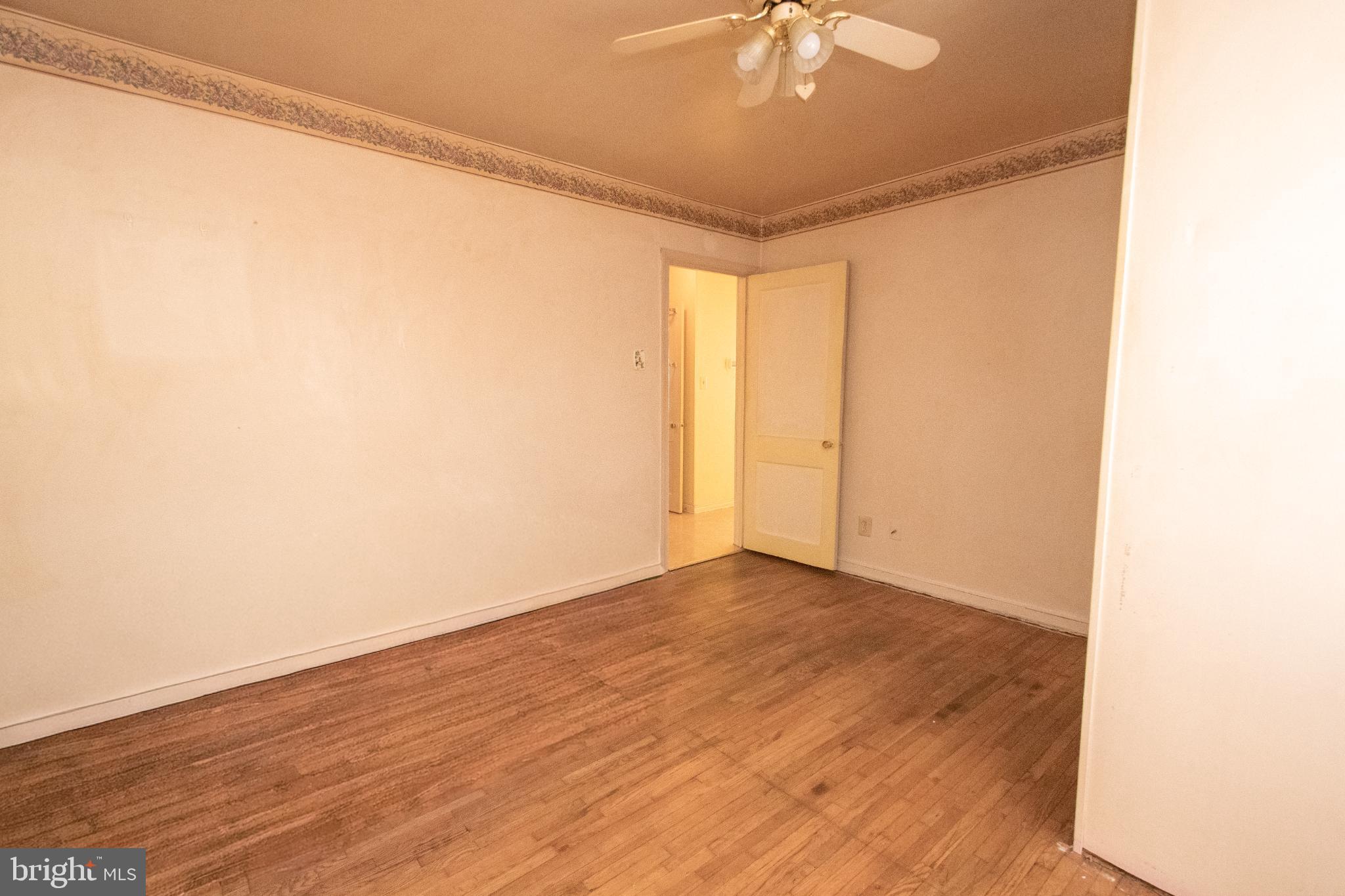 4022 West 7th Street Trainer, PA 19061 - Photo 37 of 49 a view of an empty room with wooden floor