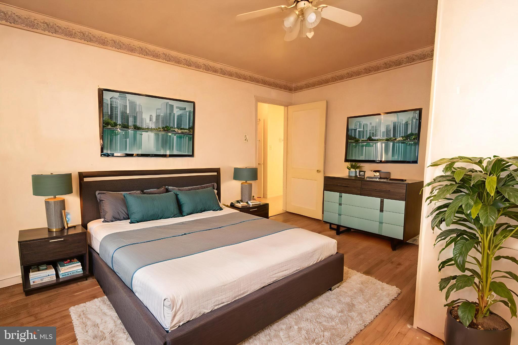 4022 West 7th Street Trainer, PA 19061 - Photo 38 of 49 a bedroom with a bed and a flat screen tv