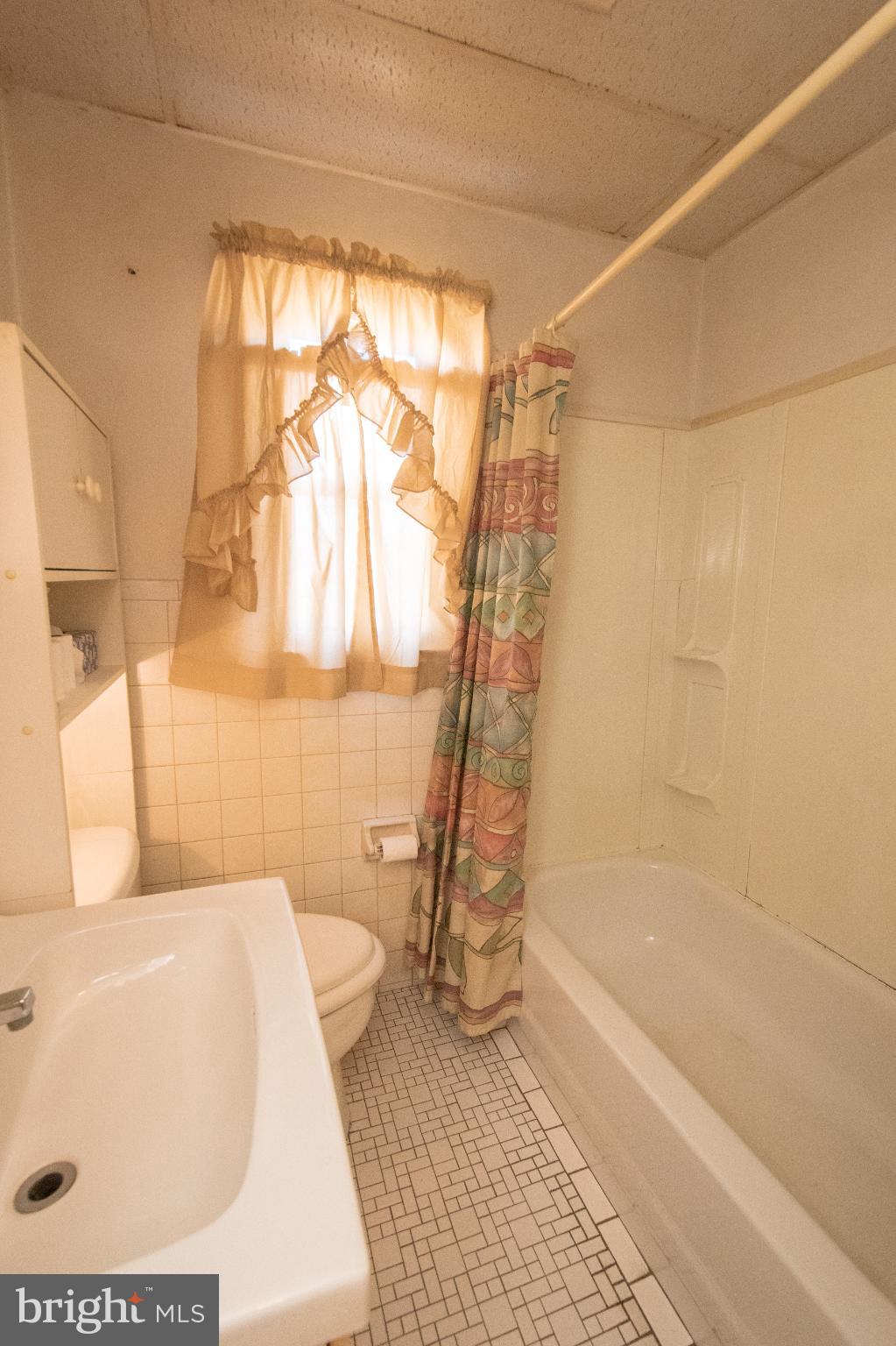 4022 West 7th Street Trainer, PA 19061 - Photo 40 of 49 a bathroom with a bathtub a toilet and a shower