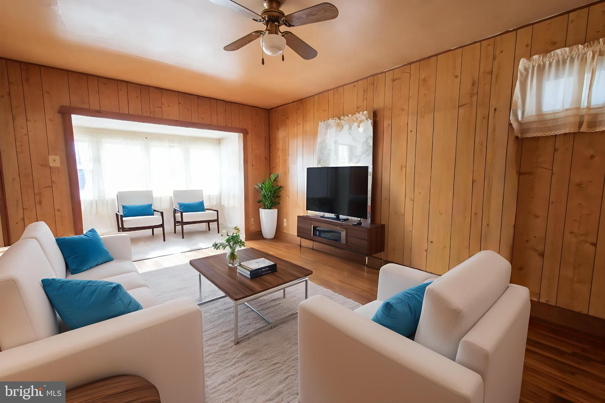4022 West 7th Street Trainer, PA 19061 - Photo 9 of 49 a living room with furniture and a flat screen tv