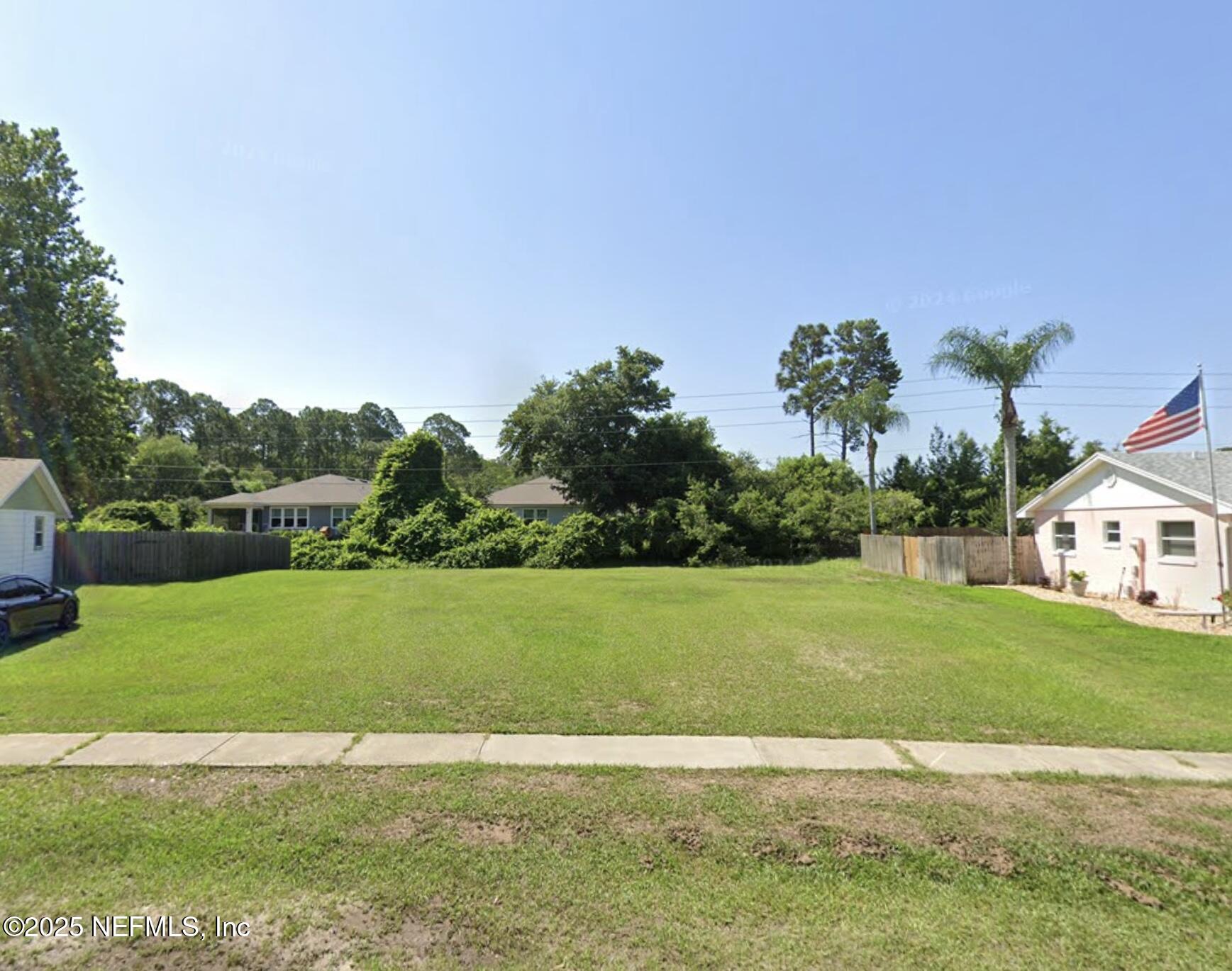 837 Rita Circle St. Augustine, FL 32086 - Photo 1 of 4 a view of a big yard with a palm tree