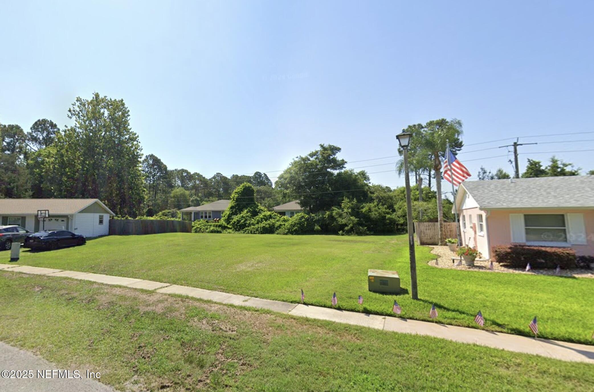 837 Rita Circle St. Augustine, FL 32086 - Photo 2 of 4 a view of a house with a big yard
