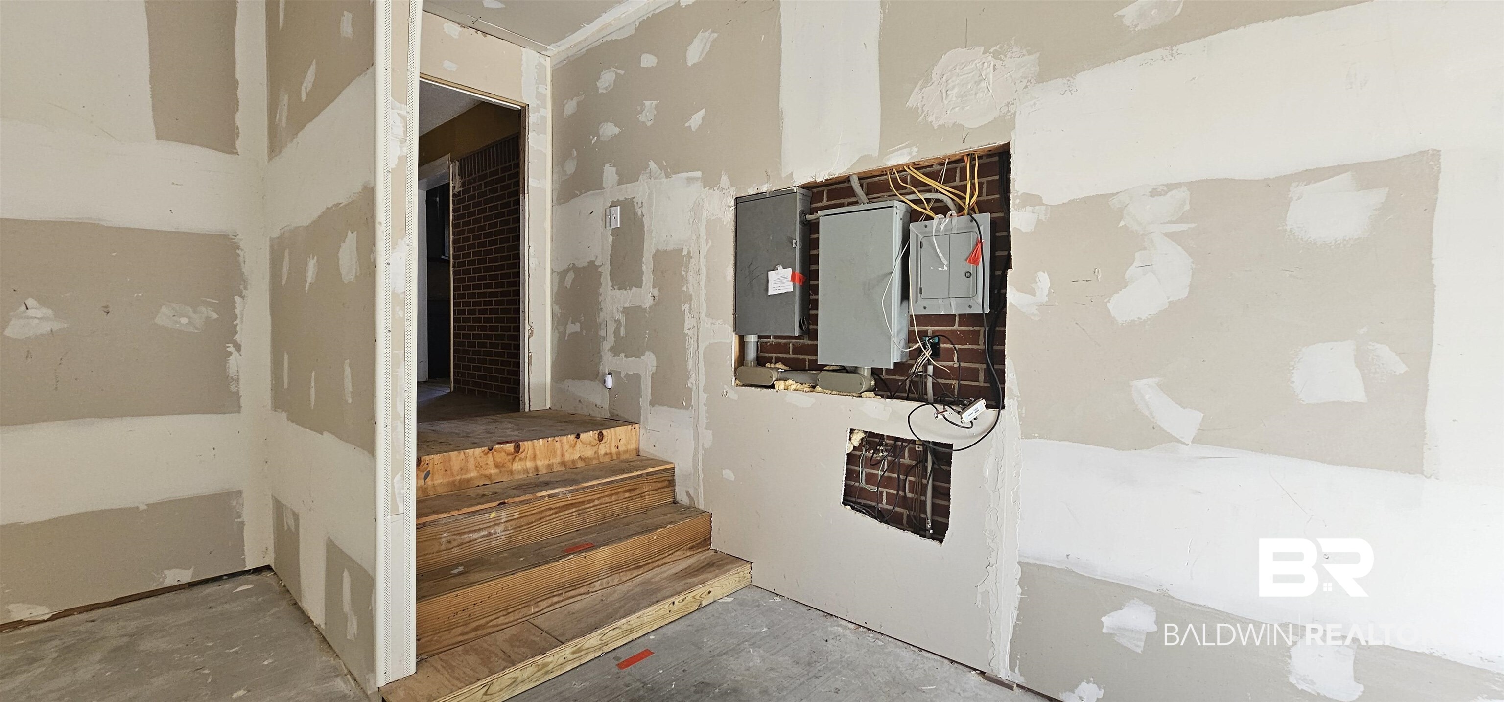 151 Bullard Street Atmore, AL 36502 - Photo 31 of 38 Staircase featuring electric panel
