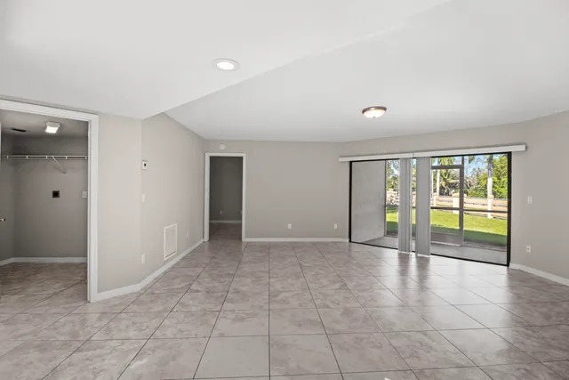 a kitchen with a granite countertop refrigerator and a sink