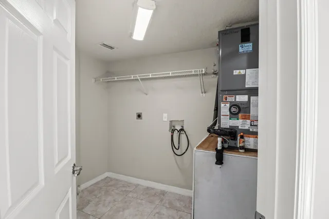 a view of a kitchen with a sink and a refrigerator
