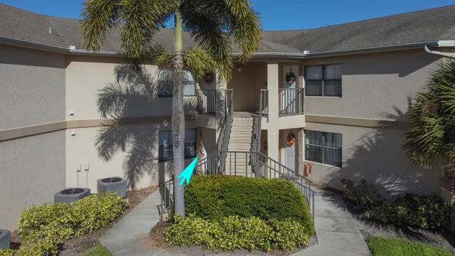 a kitchen with a refrigerator and a sink