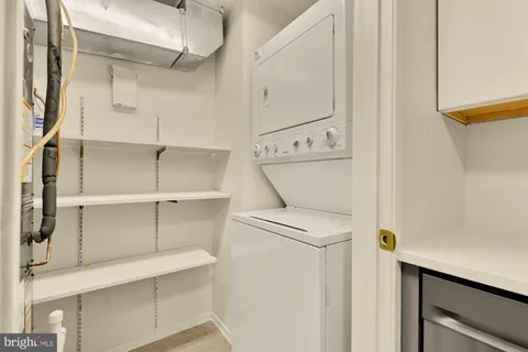a view of a kitchen with wooden floor and stairs