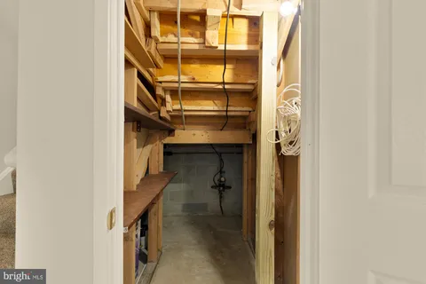 a view of hallway with couch and a table