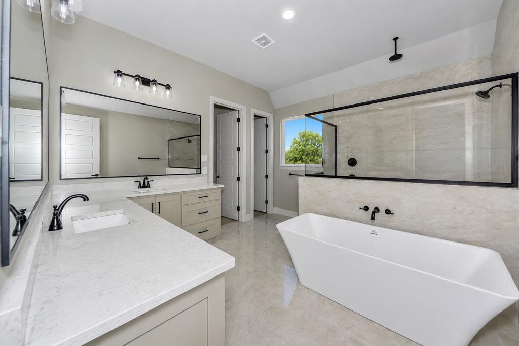 1057 Vh Ranch Poolville, TX 76487 - Photo 18 of 38 a spacious bathroom with a sink double vanity and mirror
