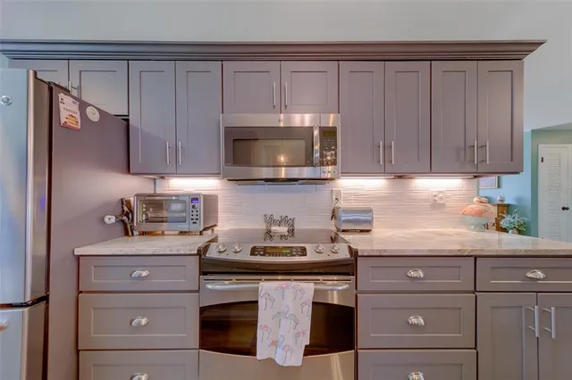 a living room with furniture a rug and a window