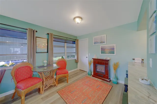 a bedroom with furniture and a chair