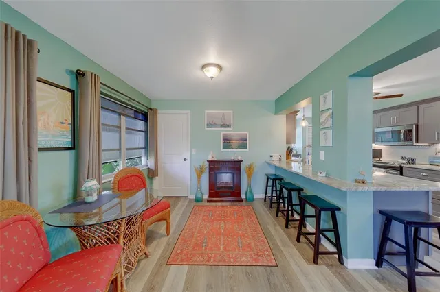 a bathroom with a sink vanity toilet and shower