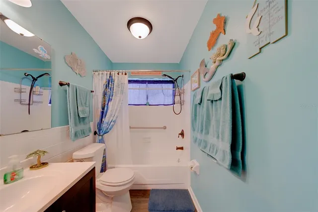 a view of a patio with table and chairs potted plants