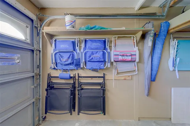 an aerial view of a residential houses with outdoor space and street view