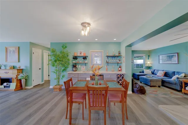 a kitchen with white cabinets and appliances