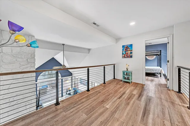 a living room with furniture and a lamp