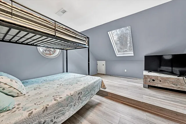 a view of a livingroom with furniture and a table