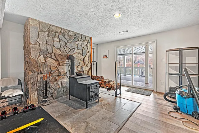 a view of a balcony with wooden benches and city view