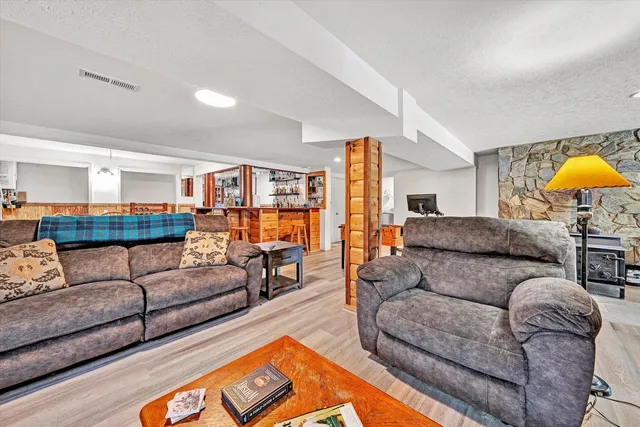 a view of balcony with furniture and wooden floor