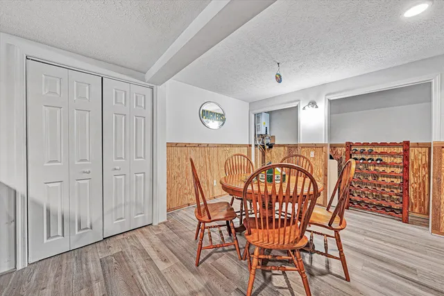 a lake view with tables and chairs