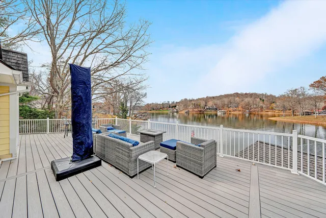 an aerial view of a house with backyard