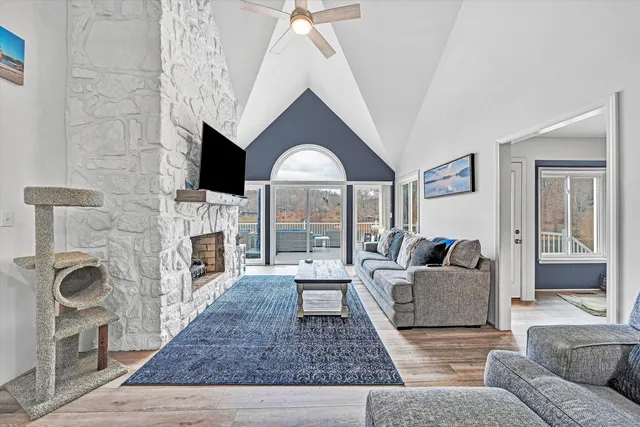 a dining room with furniture window and wooden floor