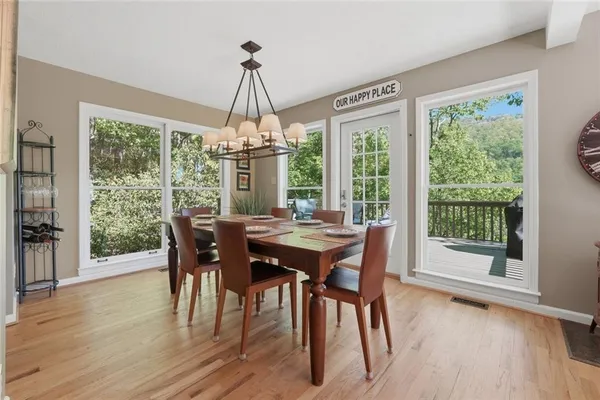 a view of a dining room with furniture window and wooden floor