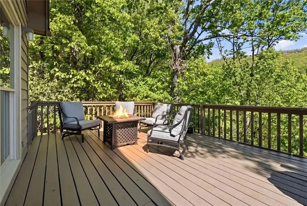 a view of a chairs on wooden deck