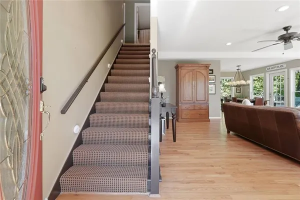a view of an entryway with wooden floor and windows