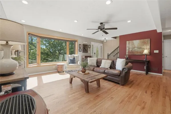a living room with furniture and a large window