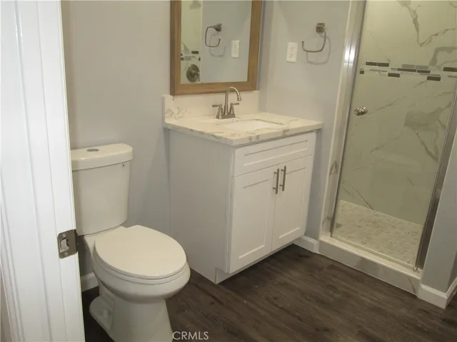 a bathroom with a toilet sink and shower