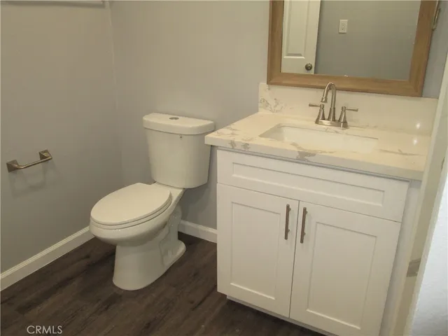 a bathroom with a toilet and a sink