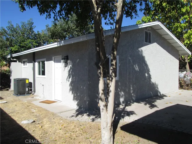 a view of a house with a snow in the background