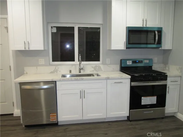 a kitchen with a stove and a microwave