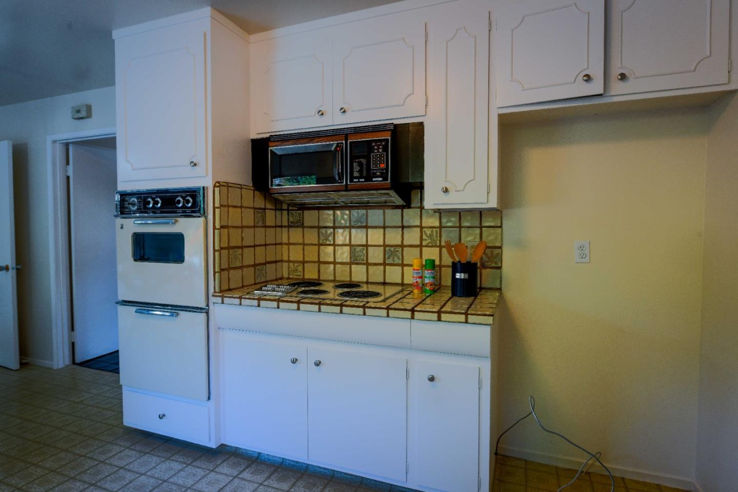 1130 Bruckner Circle Mountain View, CA 94040 - Photo 13 of 41 a kitchen with stainless steel appliances white cabinets and a stove top oven