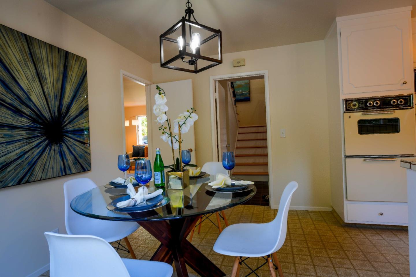 1130 Bruckner Circle Mountain View, CA 94040 - Photo 14 of 41 a dining room with furniture a chandelier and window
