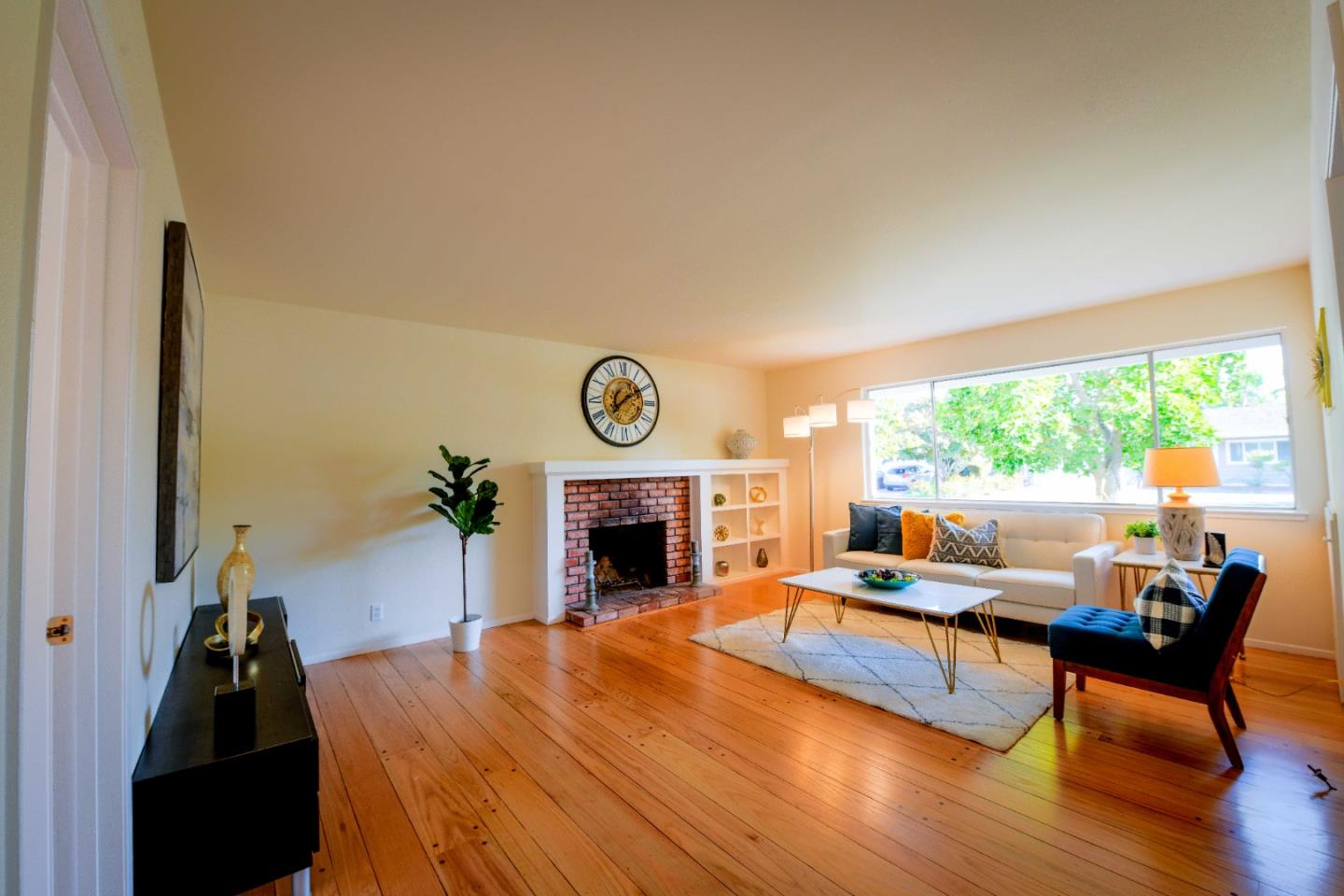 1130 Bruckner Circle Mountain View, CA 94040 - Photo 16 of 41 a living room with furniture and a fireplace