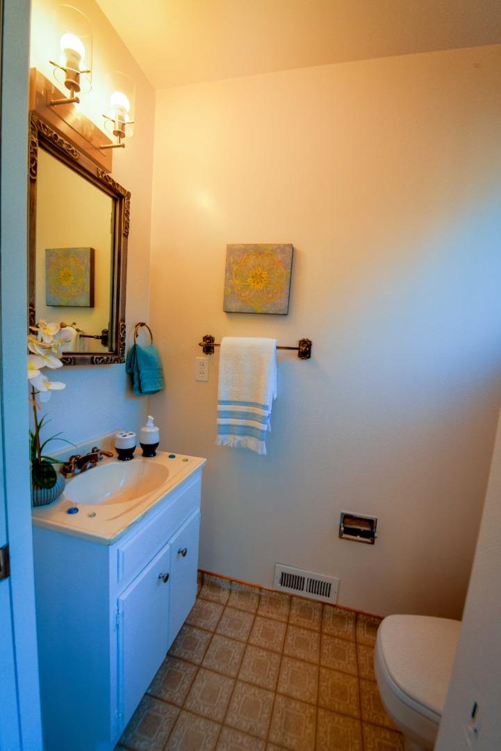 1130 Bruckner Circle Mountain View, CA 94040 - Photo 19 of 41 a bathroom with a sink a toilet and mirror